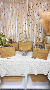 Group of handwoven rattan square totes showing the five batik lining colors