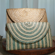 two handbags made of woven straw, one with a light brown color and the other with a green and white striped pattern.