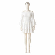 A mannequin wearing a white off-the-shoulder dress with bell sleeves and a ruffled skirt.