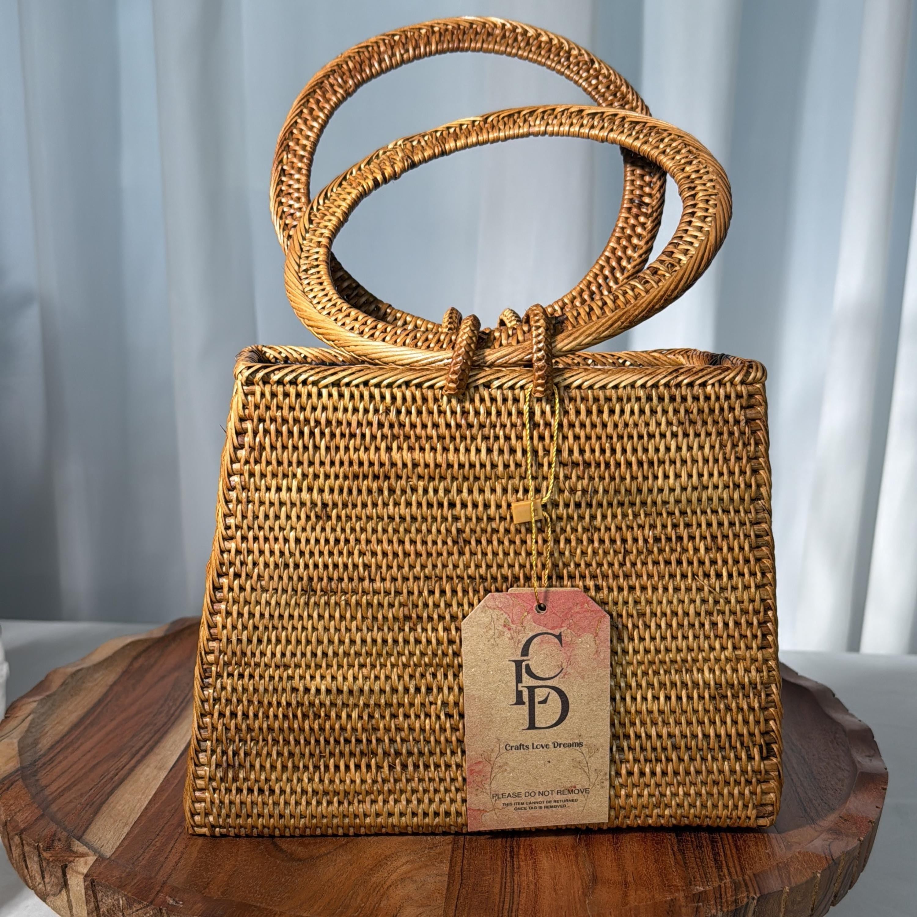 A woven handbag with a brown, textured pattern sits on a wooden surface.