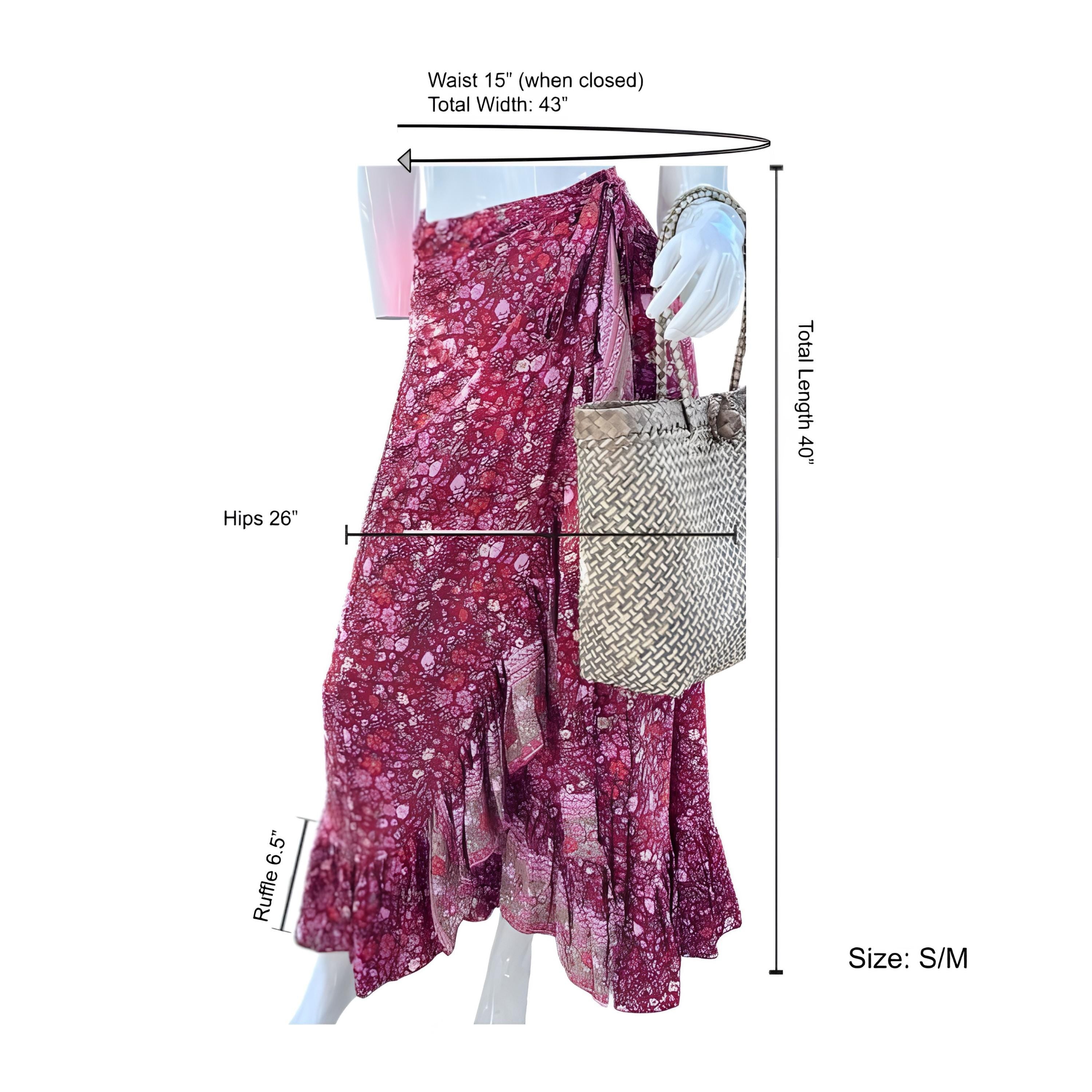a mannequin wearing a pink floral print skirt, with a woven purse being held by the mannequin. The skirt is described as a wrap skirt, and the mannequin is shown with its hips measuring 26 inches. The image also includes measurements for the waist and total width of the skirt.