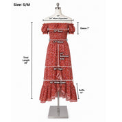 a red floral print dress displayed on a mannequin. The dress has a total length of 39 inches and a waist measurement of 17 inches. The dress also has a ruffled skirt and a ruffle at the bottom, and it has a bust measurement of 24 inches. The dress is designed for a woman with a waist measurement of 34 inches and hips measurement of 40 inches. The dress is described as having a ruffle at the bottom, which is 10 inches wide.