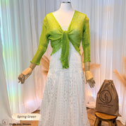 Spring green sheer knit tie-front cardigan shrug on a mannequin over a white lace dress with a Crafts Love Dreams jute dust bag